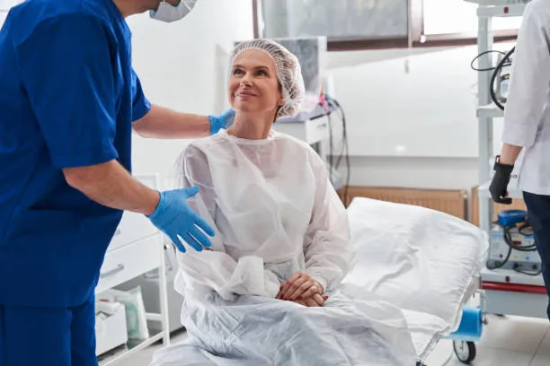 A doctors calms a patient before a surgery